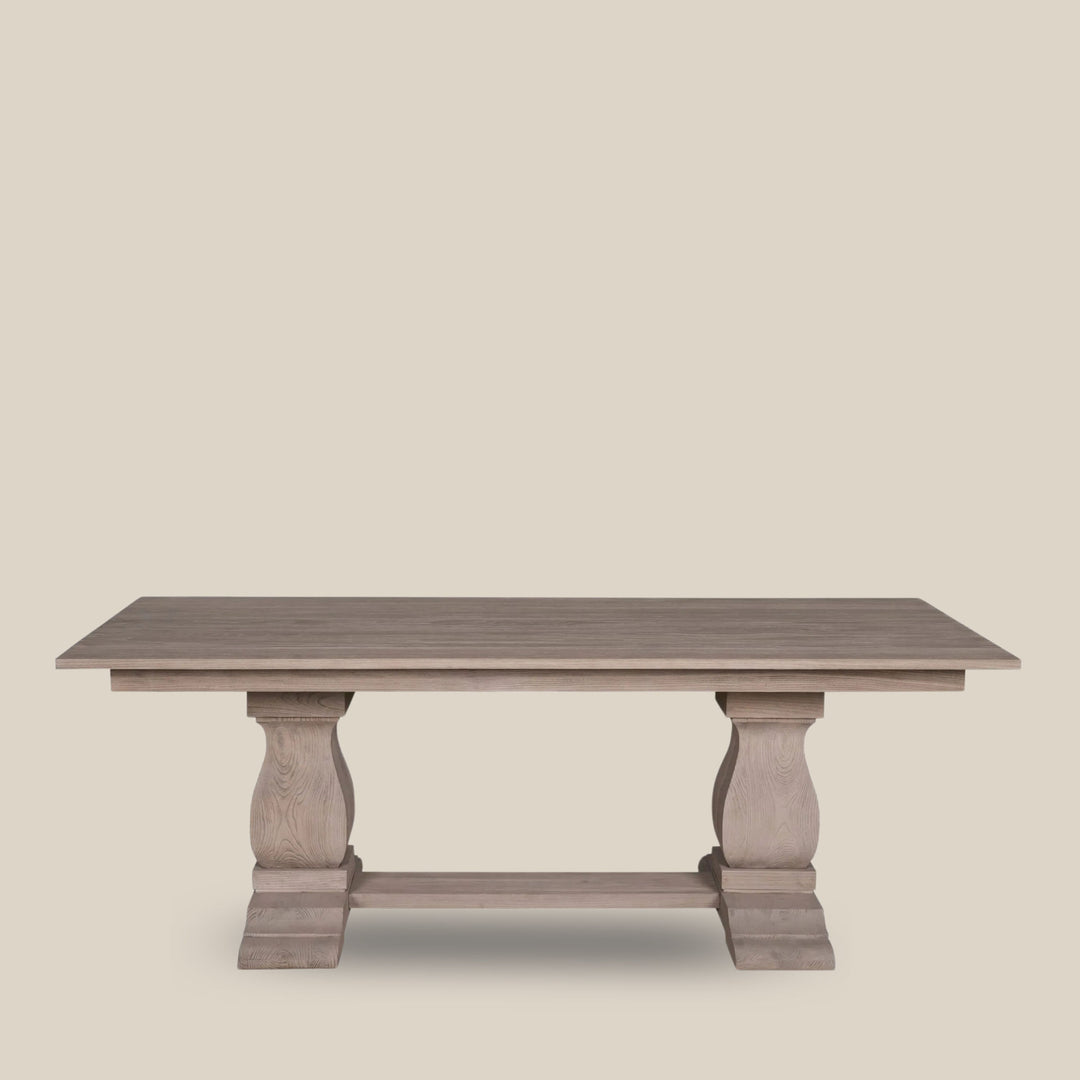 A rectangular rustic brown dining table with a strong wax finish, featuring a natural grain and texture of the wood, with turned legs - Escapology Home