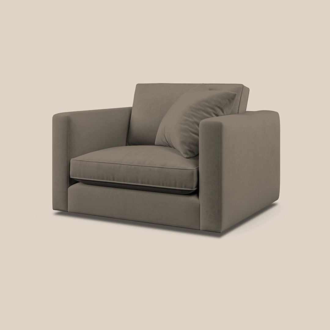 Gray armchair with a pillow on a beige background - Escapology Home