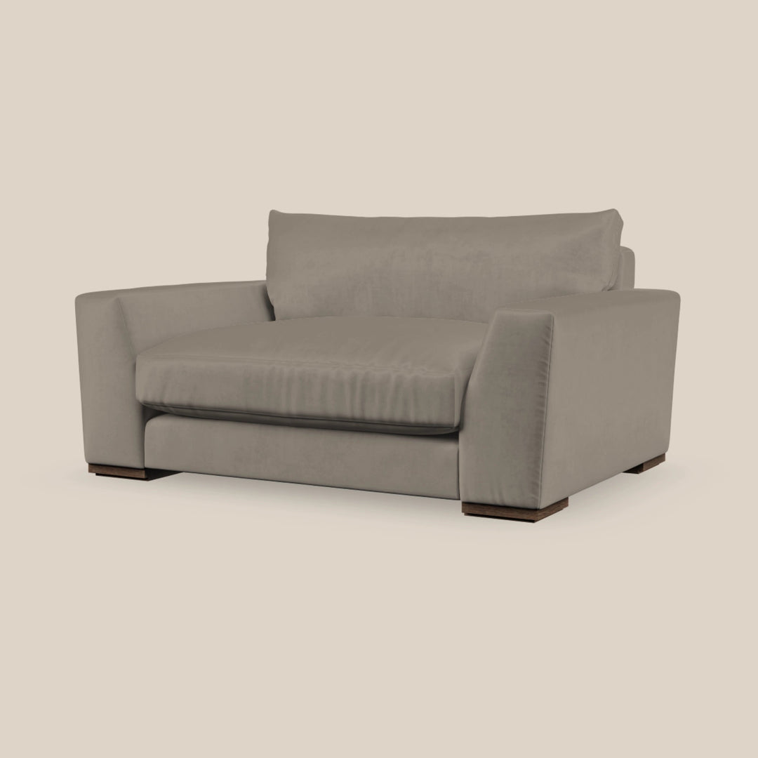 Grey lounge chair on a beige background - Escapology Home