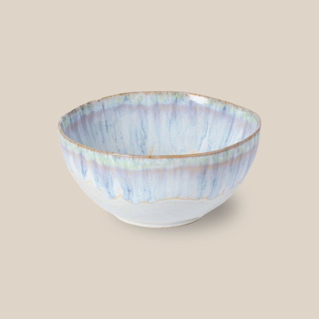 A Costa Nova Brisa cereal bowl with blue glaze