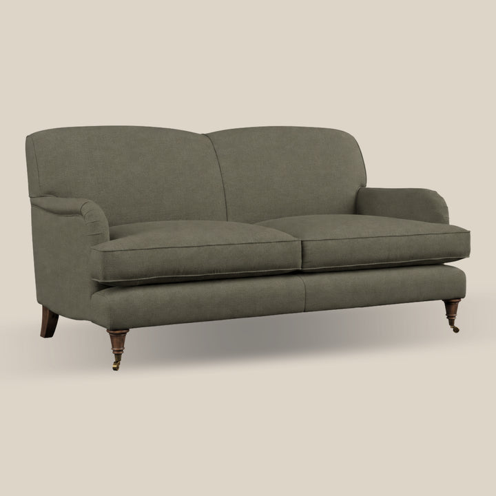 A two-seater howard sofa upholstered in green linen fabric with dark brown wooden legs, shown against a solid light beige background.
