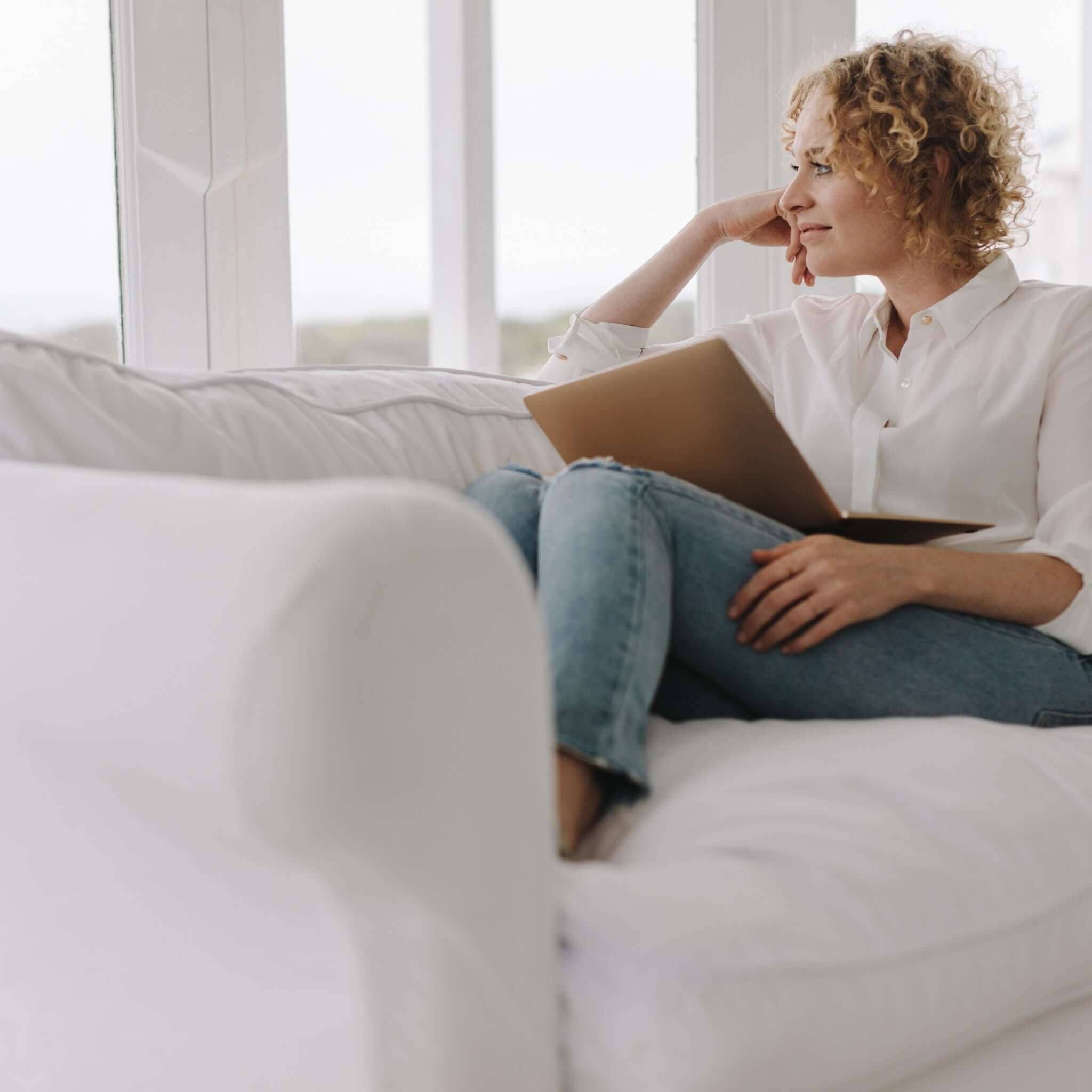 Female relaxing on a Lincombe loose cover sofa