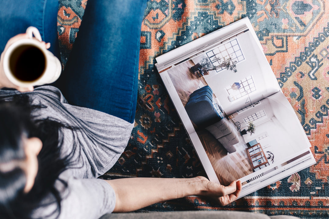 Woman reading an interior design magazine